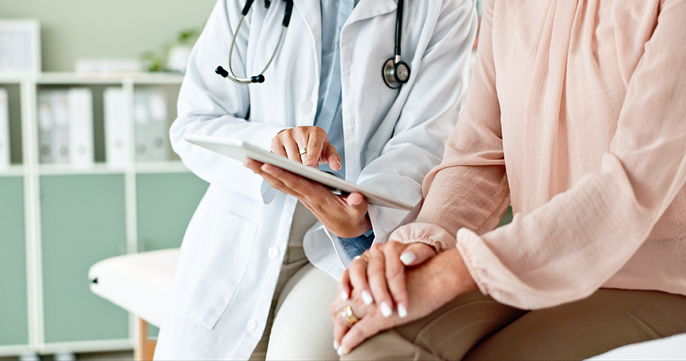 closeup of patient speaking with doctor